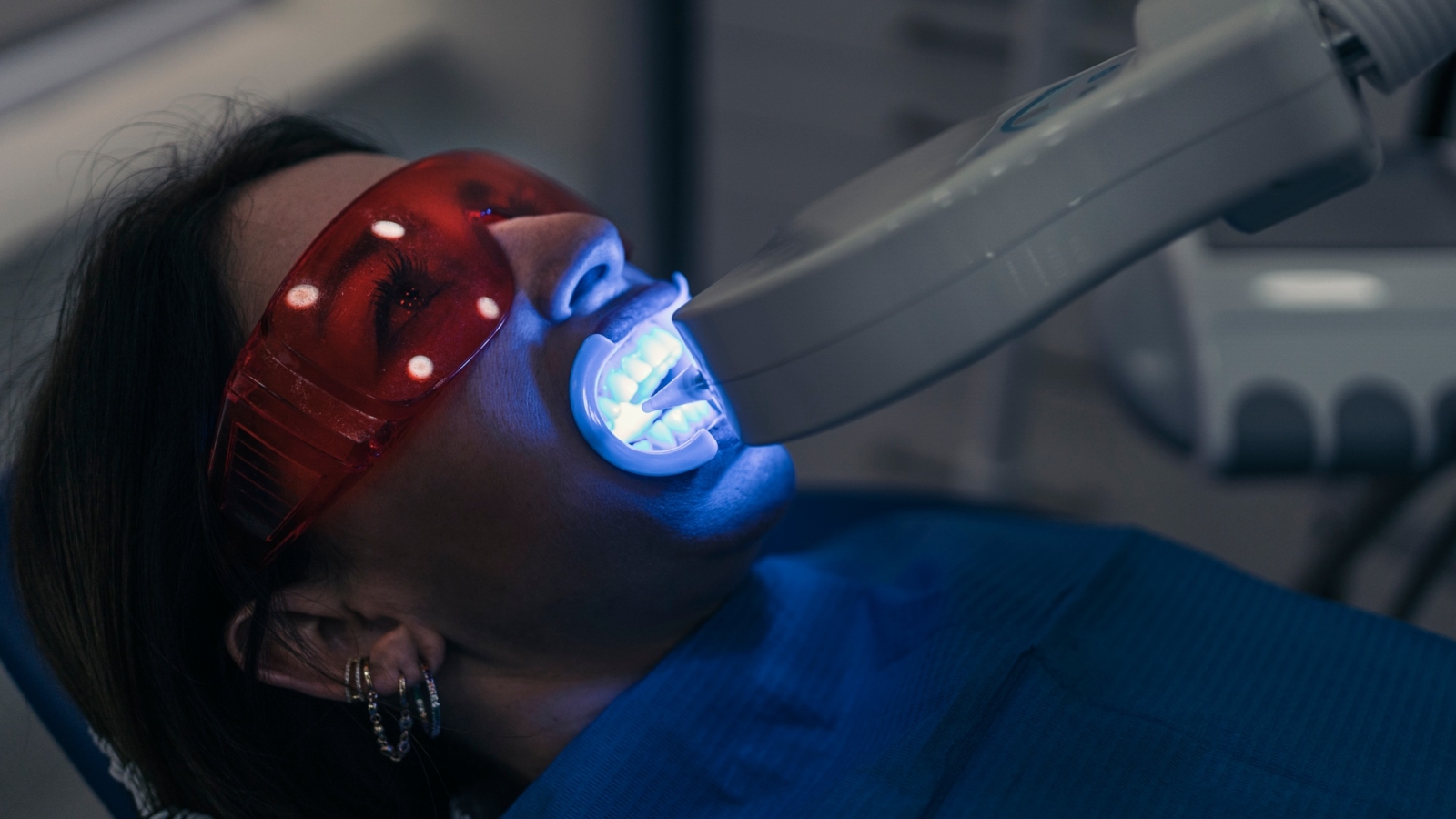 Woman Doing Tooth Whitening Treatment